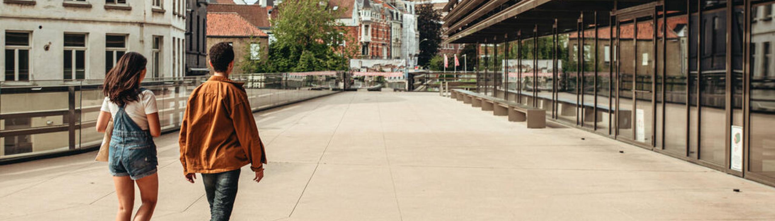 Square in Ghent in front of the public library, two of the three towers of Ghent in the background